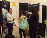 An offcial of Loews Hotels & Co. explains his business to students during the career fair.